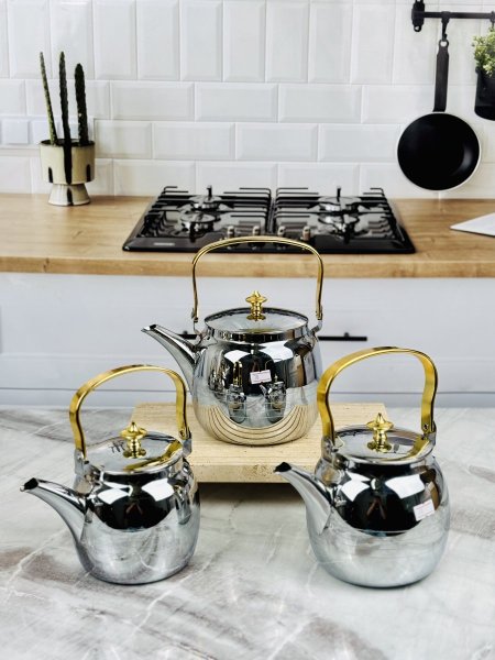 بريق شاي ستانلس مطاول مع يد ذهبي